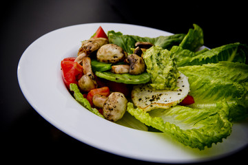 Mexican salad with guacamole and fresh cheese