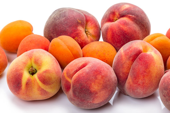 Heap ripe apricots and peaches