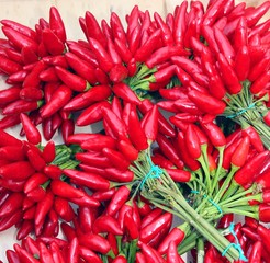 bouquets of red hot chillies on sale at the greengrocer