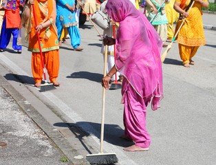 Sikh religion women during the ceremony  while sweeping the road