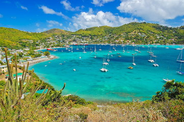 View of Admiralty bay with harbor from Hamilton Fort on Bequia Island, Caribbean Sea region of Lesser Antilles - obrazy, fototapety, plakaty