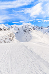 Fototapeta na wymiar Groomed walking track in beautiful mountains during winter season, Obergurgl-Hochgurgl ski area, Austria