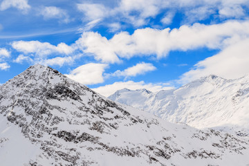 Fototapeta na wymiar View of beautiful mountain peaks covered with fresh snow during winter season, Obergurgl-Hochgurgl ski area, Austria