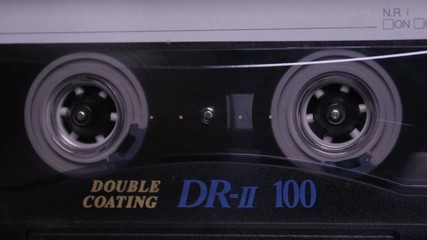 Audio Cassette in the Player. Close-up - Powered by Adobe