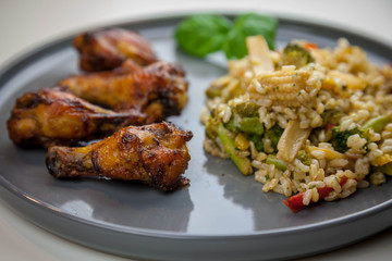 Chicken wings with sweet chilli sauce and brown rice with vegetables