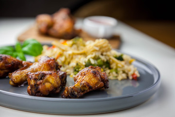Chicken wings with sweet chilli sauce and brown rice with vegetables
