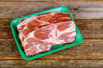 raw beef Rib steak with bone on wooden board and table