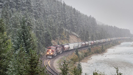 Train coming in the Autumn Snow - Banff national Park - Morants Curve