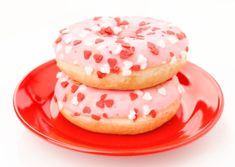 pink glazed donuts, with red hearts