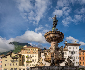 Obraz premium Trento city: main square Piazza Duomo, with clock tower and the Late Baroque Fountain of Neptune. City in Trentino Alto Adige, northern Italy, Europe