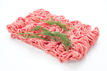 block of minced meat with dill, isolated on white background
