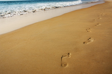 Fototapeta na wymiar footsteps on the sand