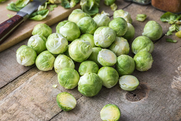 Raw brussels sprouts on jute background.