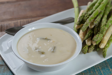 Seasonal fresh homemade asparagus soup made from white and green asparagus vegetables