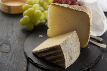Tasting of ancient french demi soft cheese Tomme from French Alps, made from cow, goat or sheep...