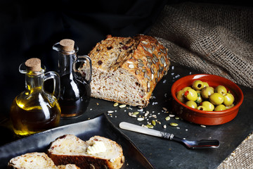 Dark Food - Fresh pumpkin seed bread with olive oil and butter