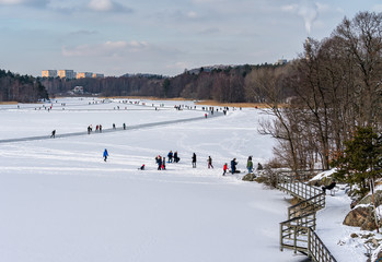 Many skaters who exercise on the lake Magelungen in Stockholm, Sweden.