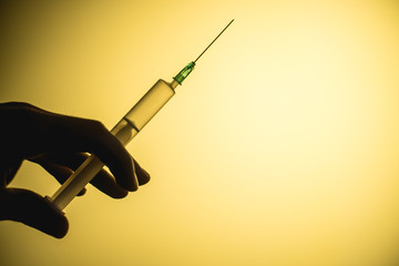 epidemic syringe on a yellow background