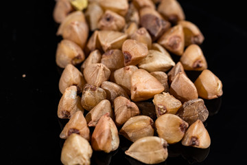 Macro collection, gluten free roasted dry boekwheat seeds close up
