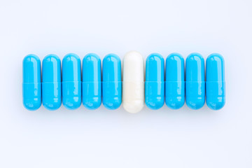 Pharmaceutical medicine capsules. Blue and white medicine capsules. Top view of medicine capsules