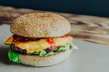 Beef burger with tomato, salad and cheese