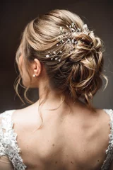 Fototapete Elegant bridal hairstyle with a hairpin and curls © Vadim Pastuh