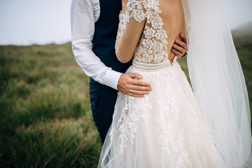 Bride and groom are hugging