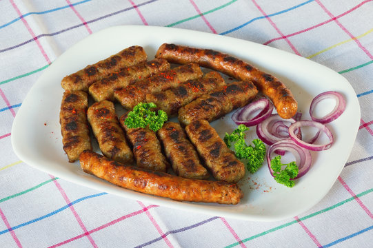 Balkan cuisine. Cevapi and kobasica  - grilled dish of minced meat