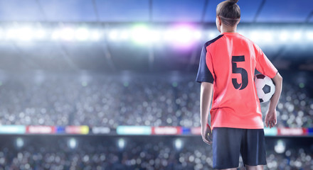 female football player in red uniform on soccer field