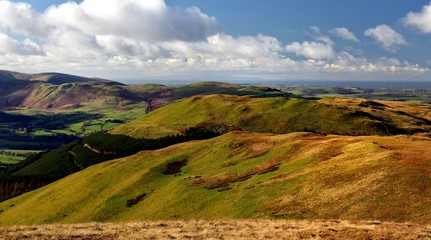 Naklejka premium Autumn sunlight over the Lorton Valley