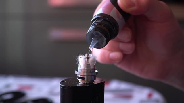 Mixing liquid for vaping using pipette closeup.