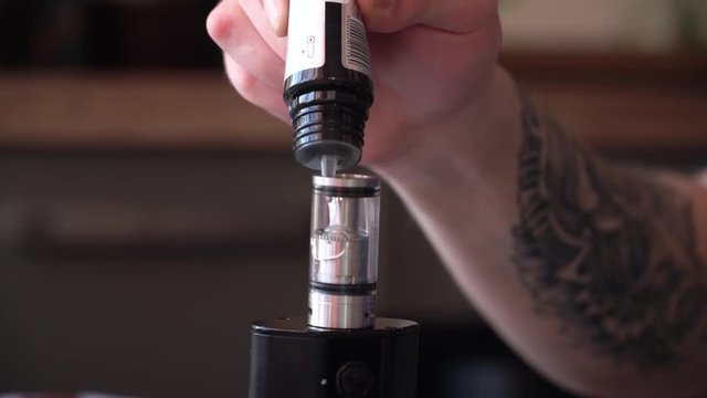 Mixing liquid for vaping using pipette closeup.