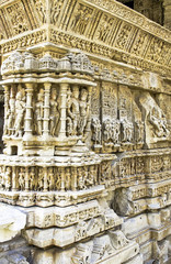 Statues of Hindu Gods and Goddesses carved on marble walls of a historic temple