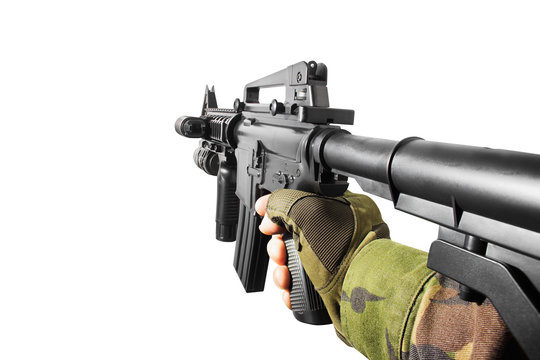 Isolated photo of shooter game vr first person view soldier hand holding automatic rifle.