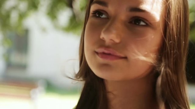closeup portrait pretty cute woman smiling outside sunny day long hair fling wind blowing haircare romantic mood thoughtful teenager girl beautiful brunette happy girl posing photosession photo flash