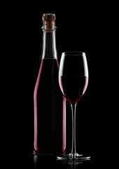 Bottle of homemade red wine and glass with cork