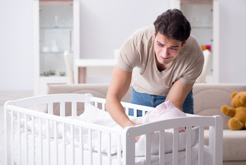 Young father dad frustrated at crying baby