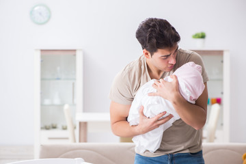 Young father dad frustrated at crying baby