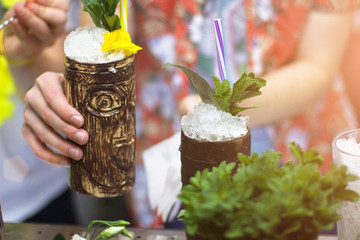 Cool tropical cocktail, the barman is working