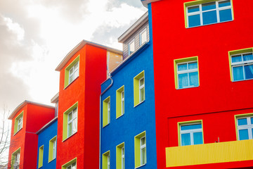 Fototapeta premium detailed view of high contrasted building in blue and red