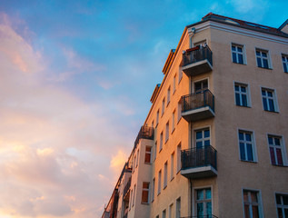 warm colored corner building in the eve with some copy space on the left side