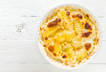 Baked potato gratin with garlic, cream and parmesan cheese