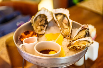 Fresh oysters lying on the ice.