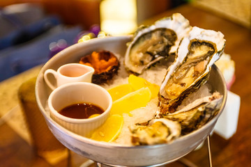 Fresh oysters lying on the ice.
