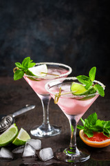 Margarita cocktail with salted rim, fresh lime and grapefruit juice, cold summer citrus refreshing drink or beverage with ice