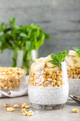 Layered chia pudding parfait with banana, sweet wheat with honey and yogurt, dessert