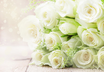 Bouquet of white roses for women's day, gray background, selective focus