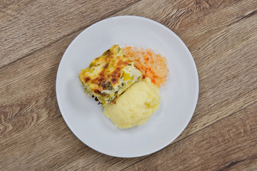 Leek lasagna and potato mash on a table