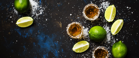Strong alcoholic drink with salt and lime, dark background, top view - Powered by Adobe
