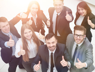 successful business team holding up a thumbs up